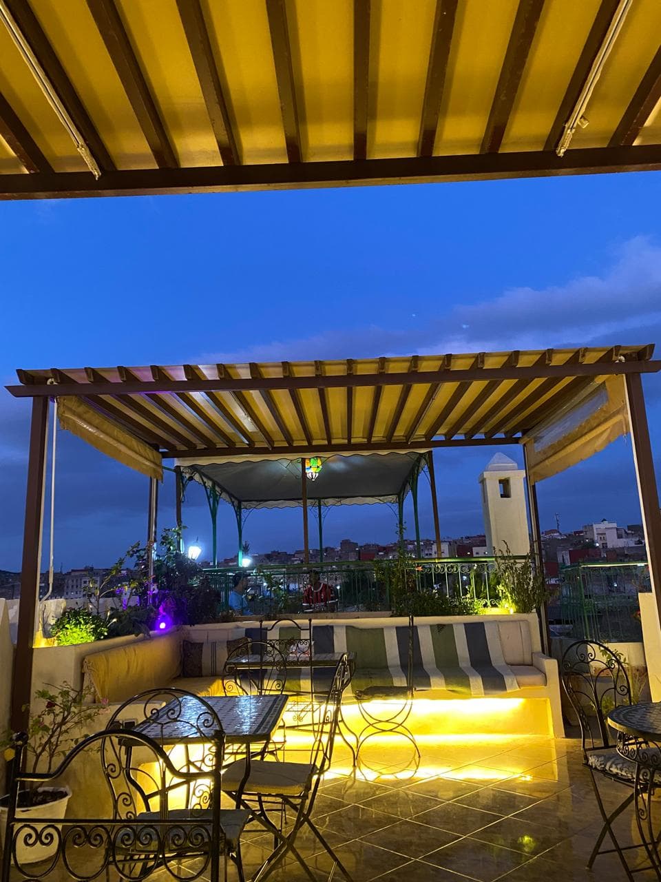 Scenic rooftop terrace at Benyamna Restaurant during sunset in Fes