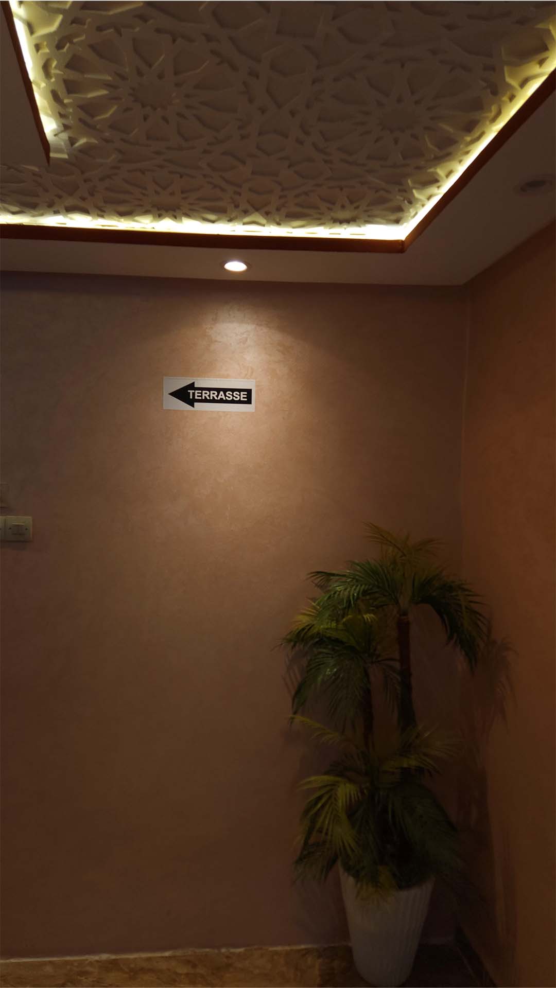 Entrance and seating area on the first floor of Benyamna Restaurant in Fes