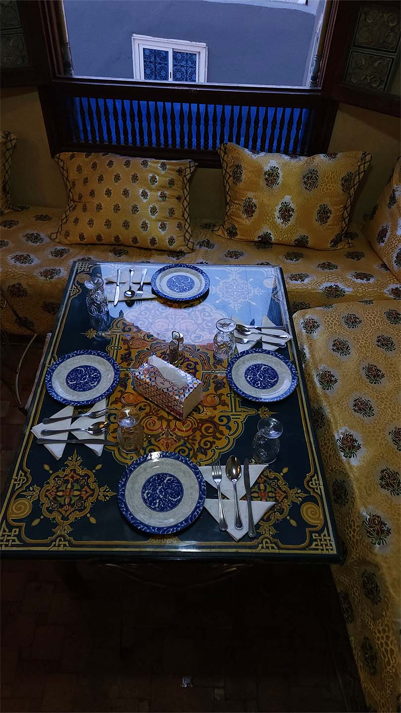 Entrance and seating area on the first floor of Benyamna Restaurant in Fes