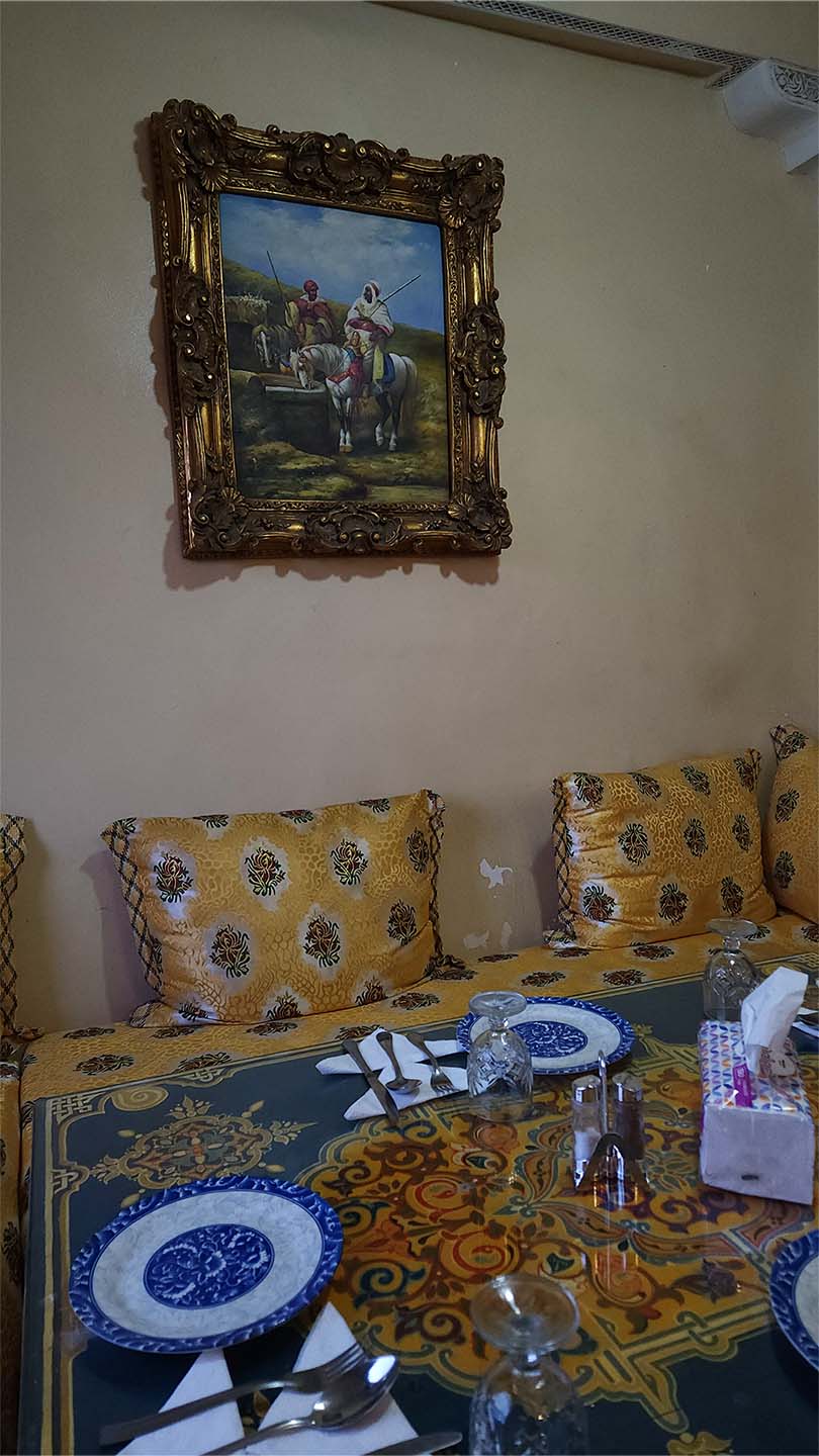 Entrance and seating area on the first floor of Benyamna Restaurant in Fes
