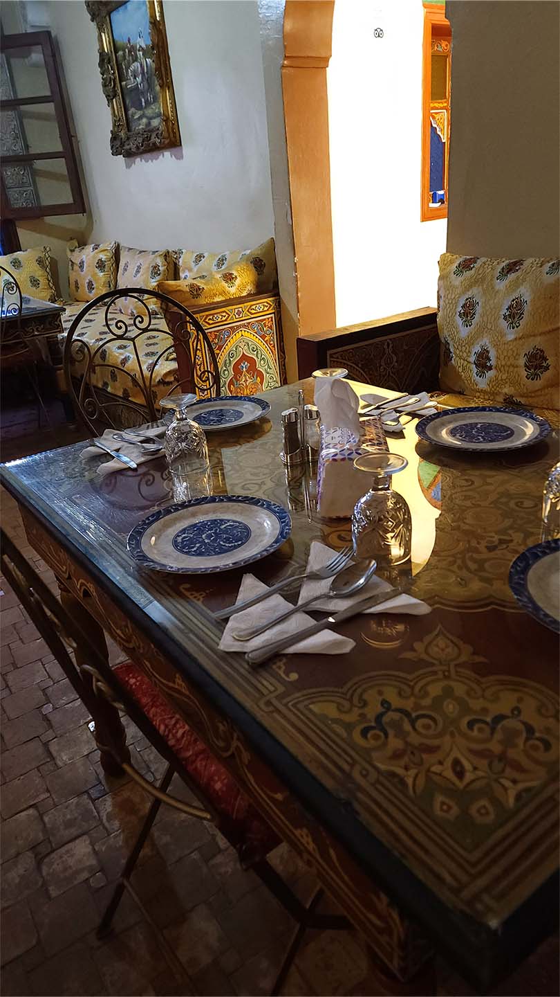 Entrance and seating area on the first floor of Benyamna Restaurant in Fes