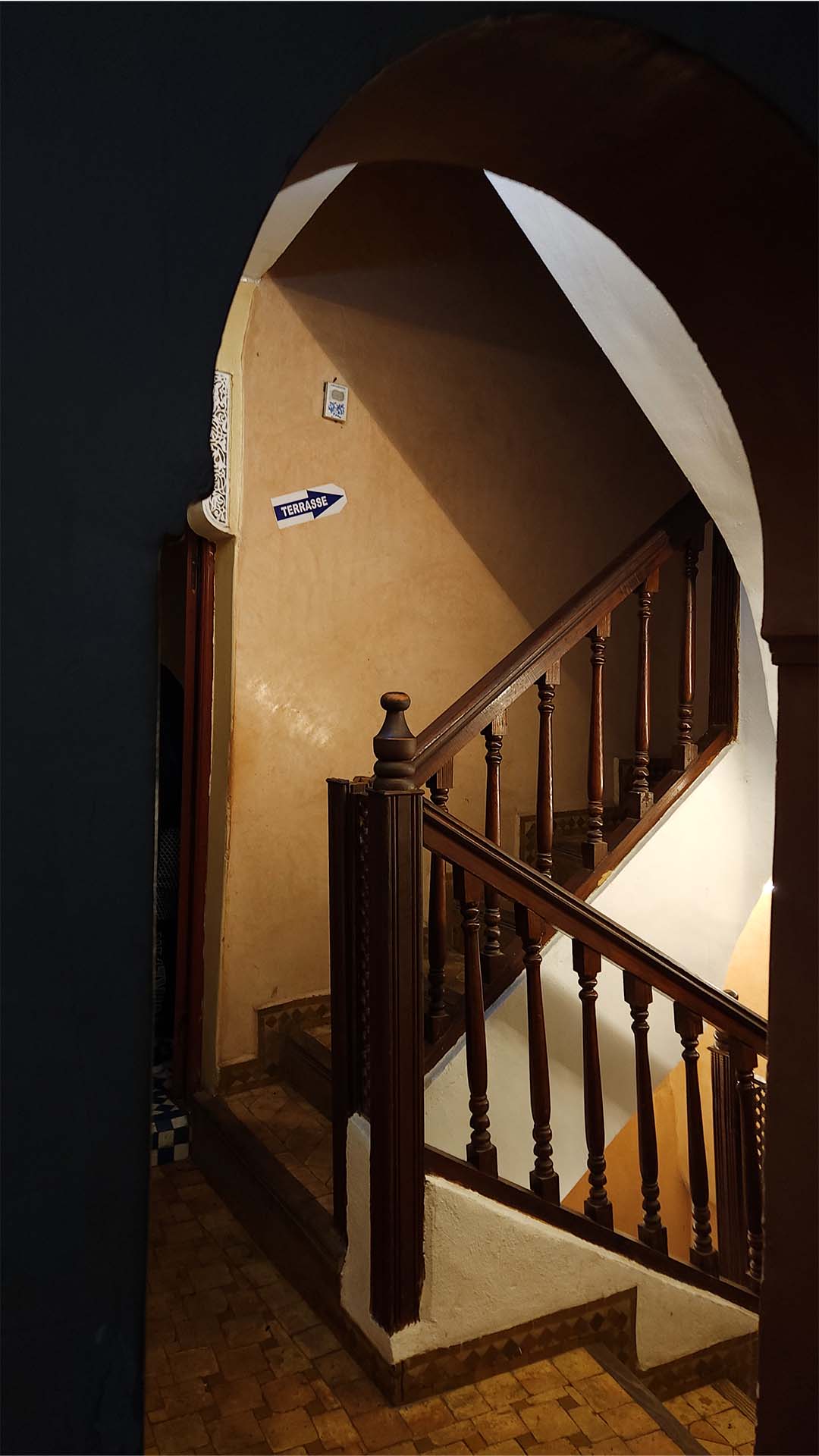 Entrance and seating area on the first floor of Benyamna Restaurant in Fes